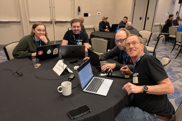 Randy at table doing first-time contributor mentoring.